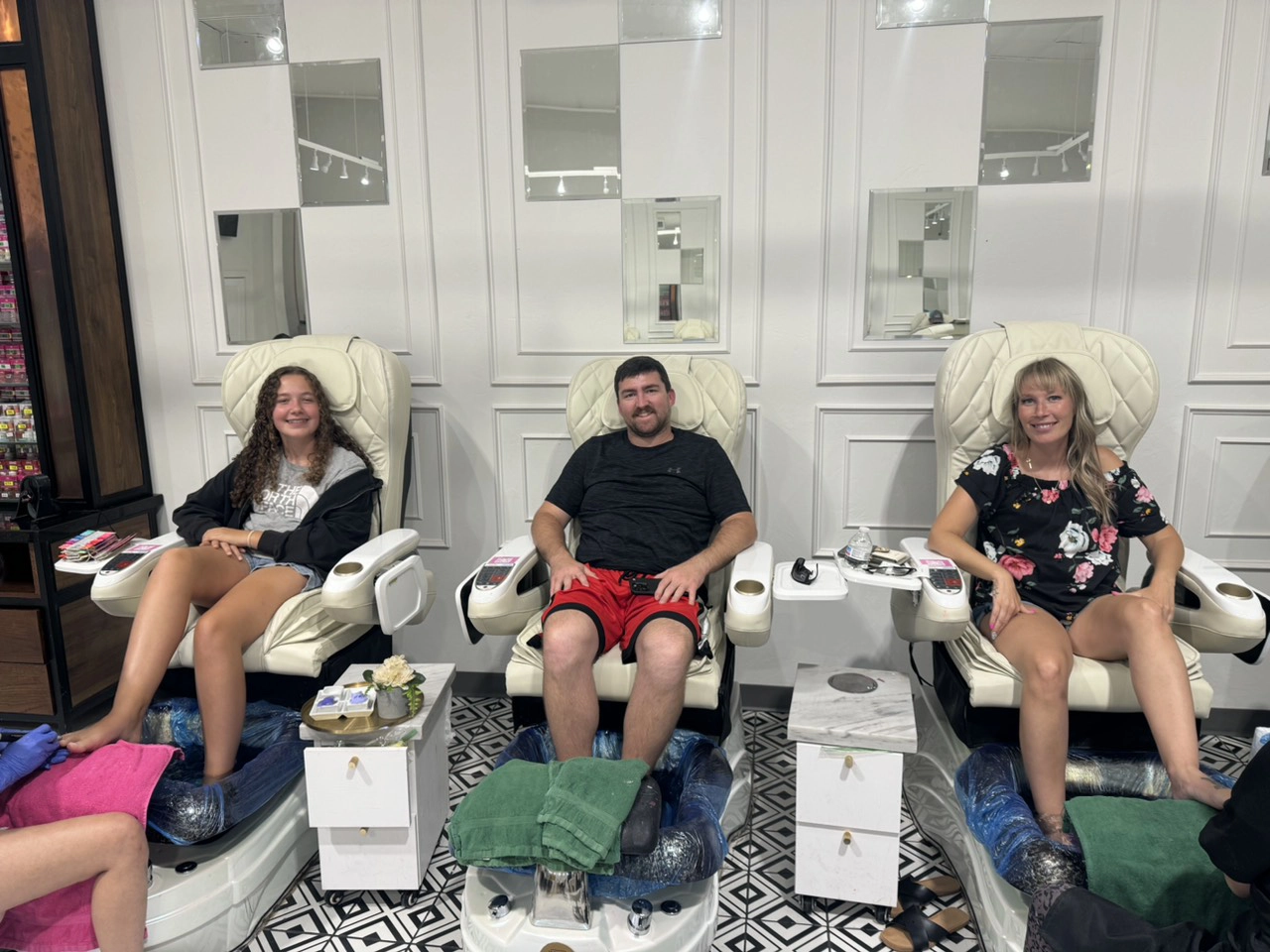 Male client receiving pedicure treatment including soak, exfoliation, and massage at Bnails Amarillo.jpg