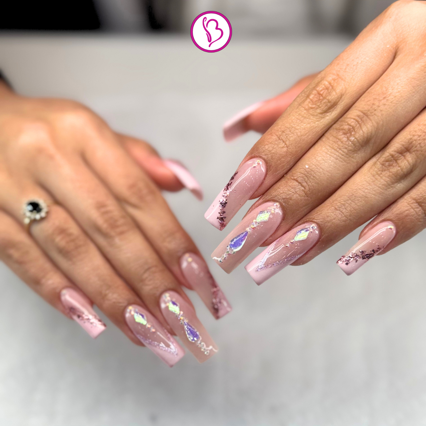 Happy clients showing their acrylic nails after appointment with Aliza at Bnails Hereford