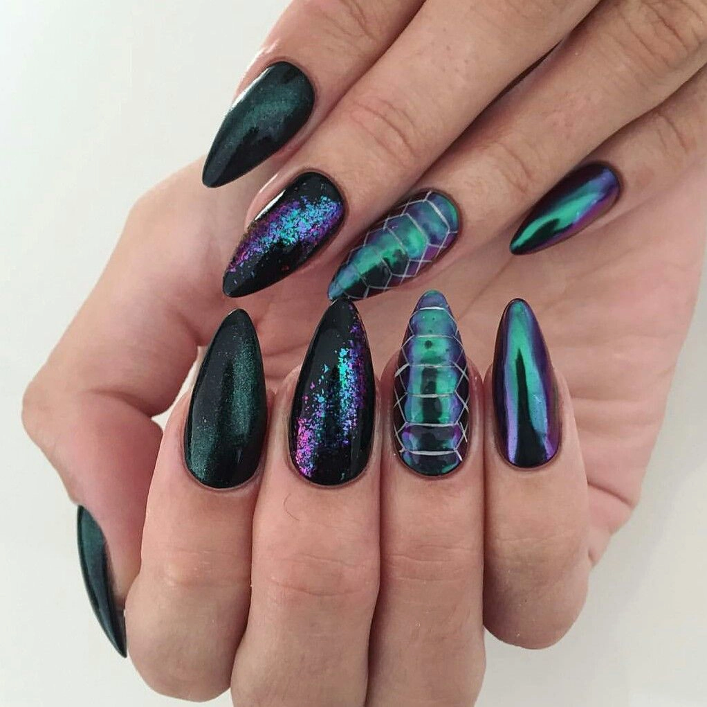 Close-up of acrylic nails in purple and emerald green designed by Jolynn at Bnails Hereford